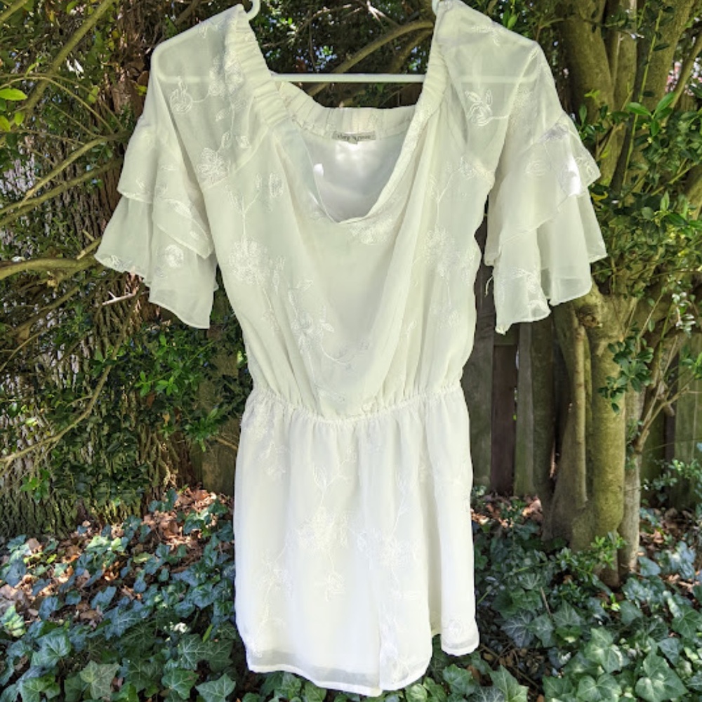 White Romper with Floral Embroidery